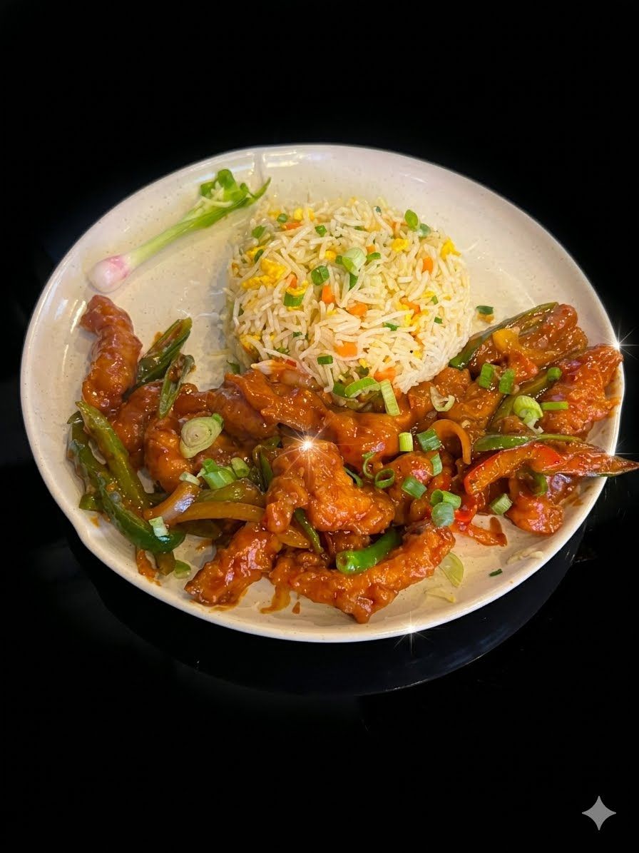 دجاج تشيلي بصل at Cock "N" Bull. طبق حار ومالح مع دجاج طري وبصل مقرمش Pakistani restaurant in Al Majarra, Sharjah, UAE