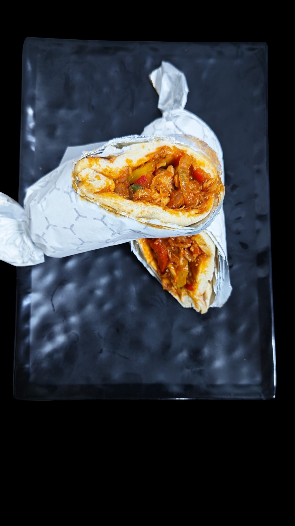 لفافة دجاج فاهيتا at Cock "N" Bull. دجاج مشوي بتوابل الفاهيتا ملفوف مع الفلفل والبصل وصلصتنا المميزة Pakistani restaurant in Al Majarra, Sharjah, UAE