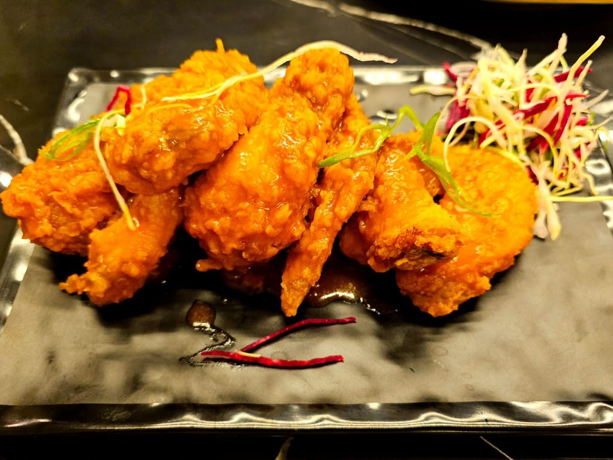 أجنحة دجاج حارة (7 قطع) — أجنحة دجاج حارة ولذيذة، مثالية لمحبي التوابل | Cock "N" Bull, Sharjah